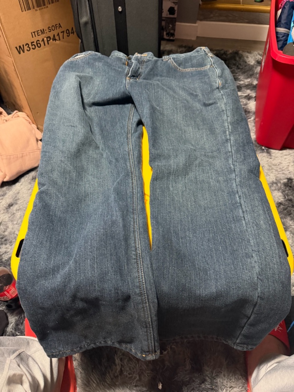 Carhartt Relaxed Fit Denim Jeans in Dark Blue with Yellow Logo